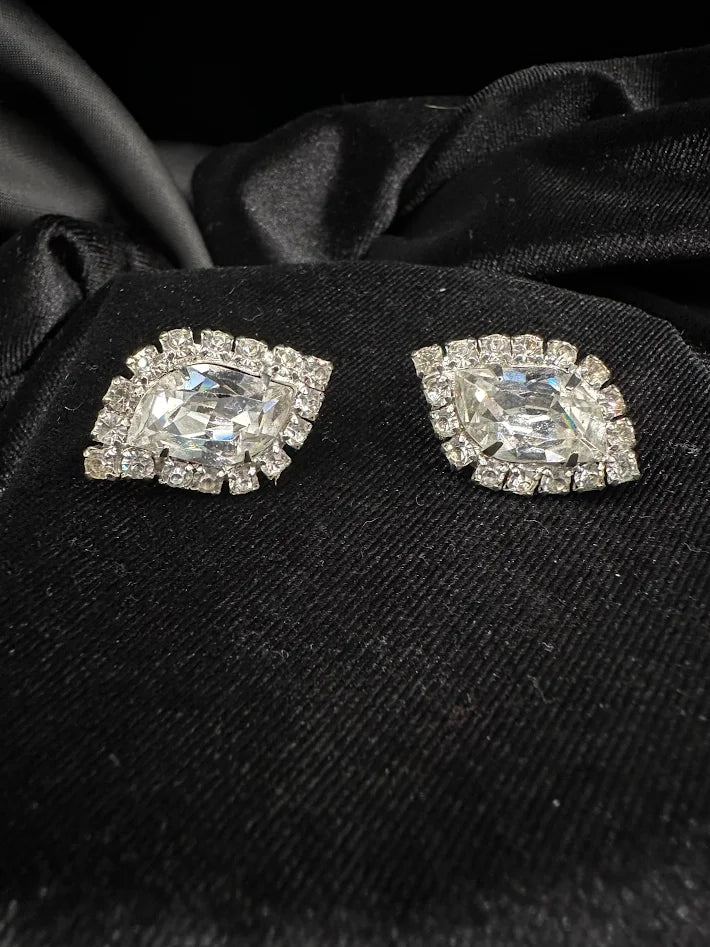 Weiss silver-tone clip earrings with marquise crystal center and round stone halo