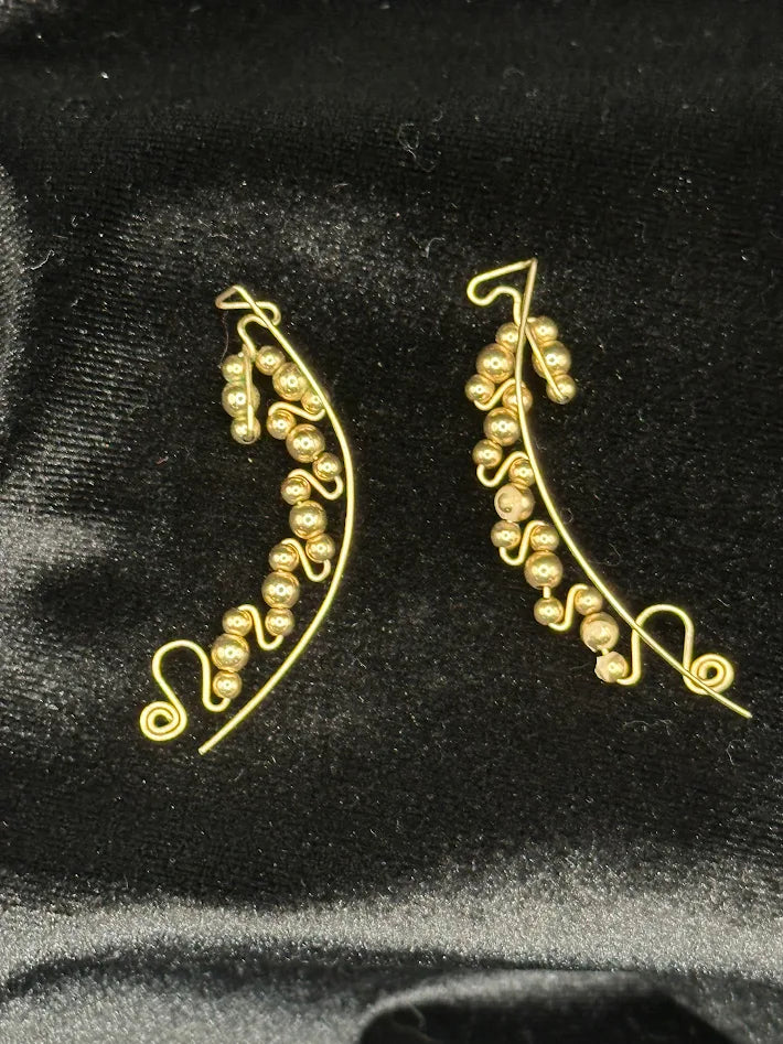 Gold tone bead swirl wire earrings with curved drop design