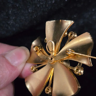 Gold-tone sunburst flower brooch with yellow and clear rhinestones in layered petals, view 3