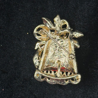 Gold-tone Christmas bell brooch with clear rhinestone rows and red and green enamel bow, view 3