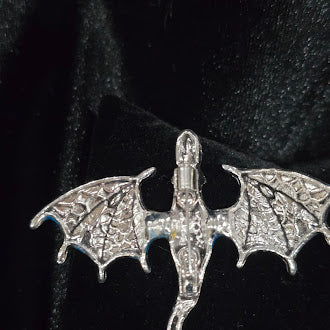 Silver-tone flying dragon brooch with blue enamel wings and rhinestone accents, view 3