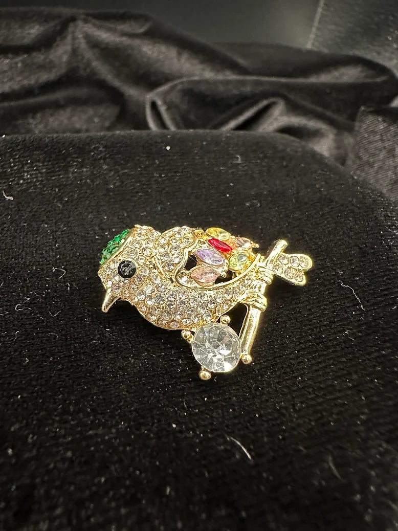 Vintage Gold Tone Rhinestone Perched Bird Brooch with Multicolor Crystals