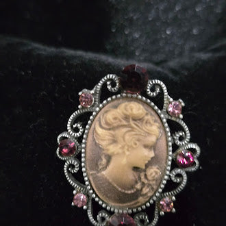 Early 1990s to 2000s Cameo Brooch Silver Tone Oval Portrait Pin with Pink Purple Rhinestones Scrollwork Frame Safety Clasp
