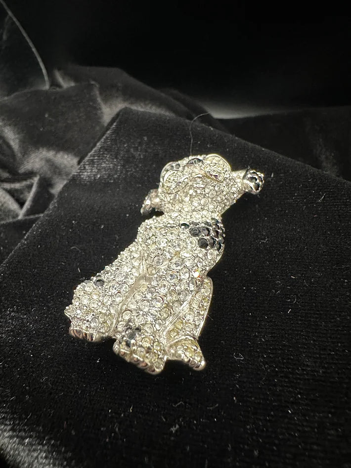 Silver-tone seated dog brooch covered in clear crystals with black crystal ears and spots, view 3