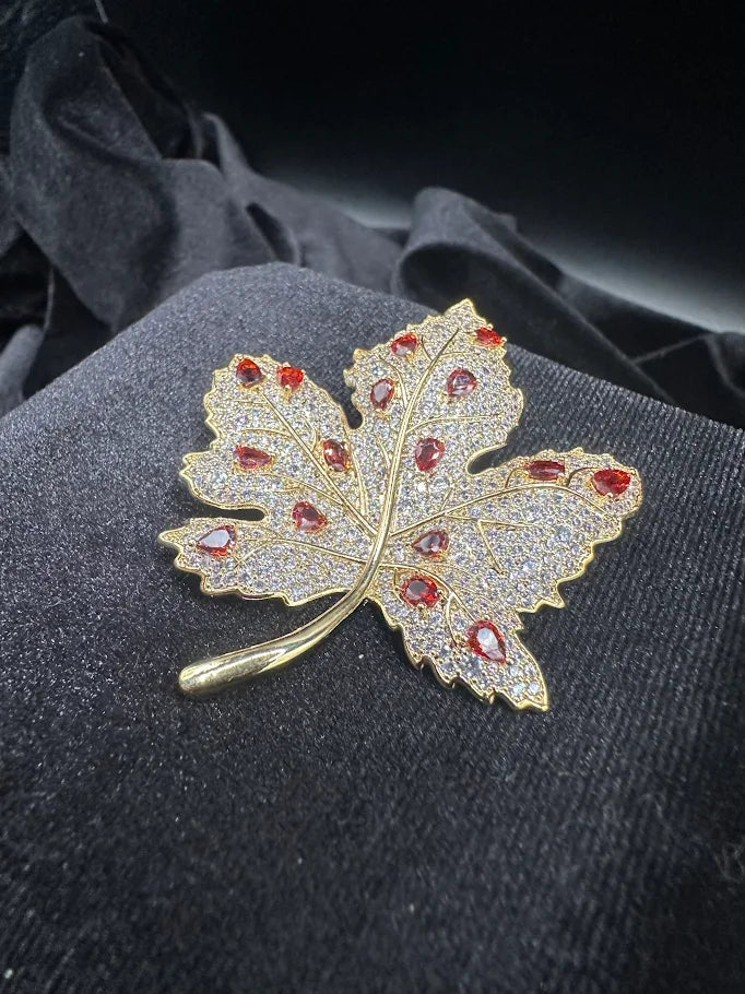Gold-tone rhinestone maple leaf brooch with red-orange accent stones, view 3