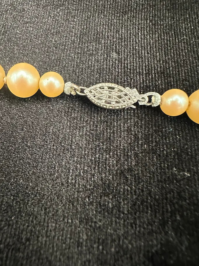 Peach faux pearl single strand necklace with gold-tone crystal accent clasp, view 2