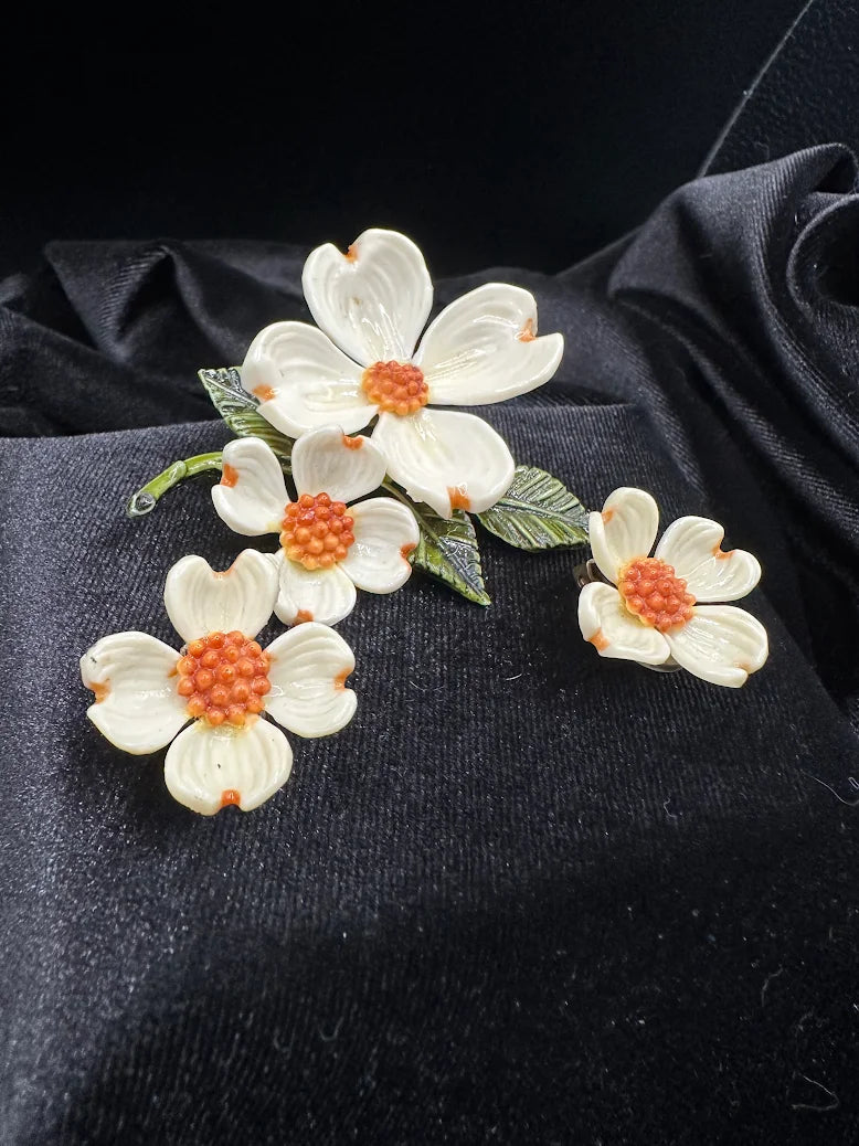 White dogwood flower brooch and clip earrings with orange bead centers and green enamel leaves, view 3