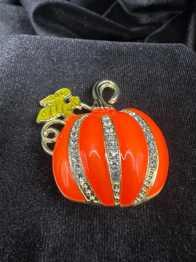 Gold-tone orange pumpkin brooch with clear rhinestone stripes, view 3