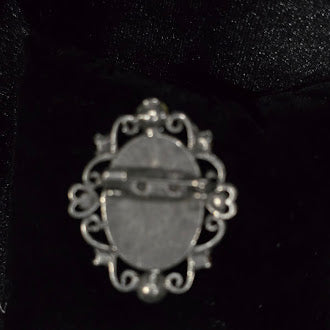 Early 1990s to 2000s Cameo Brooch Silver Tone Oval Portrait Pin with Pink Purple Rhinestones Scrollwork Frame Safety Clasp