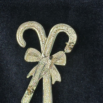 Crossed candy canes Christmas brooch with red and white enamel stripes and green bow, view 3