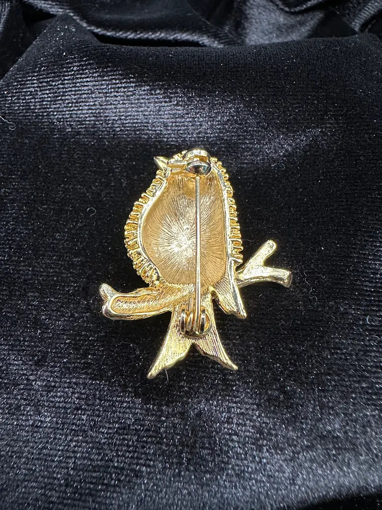 Textured gold-tone songbird brooch with green eye perched on a branch, view 5