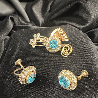 Gold-tone brooch and matching screw-back earrings with blue center stones and clear rhinestone halos, view 4