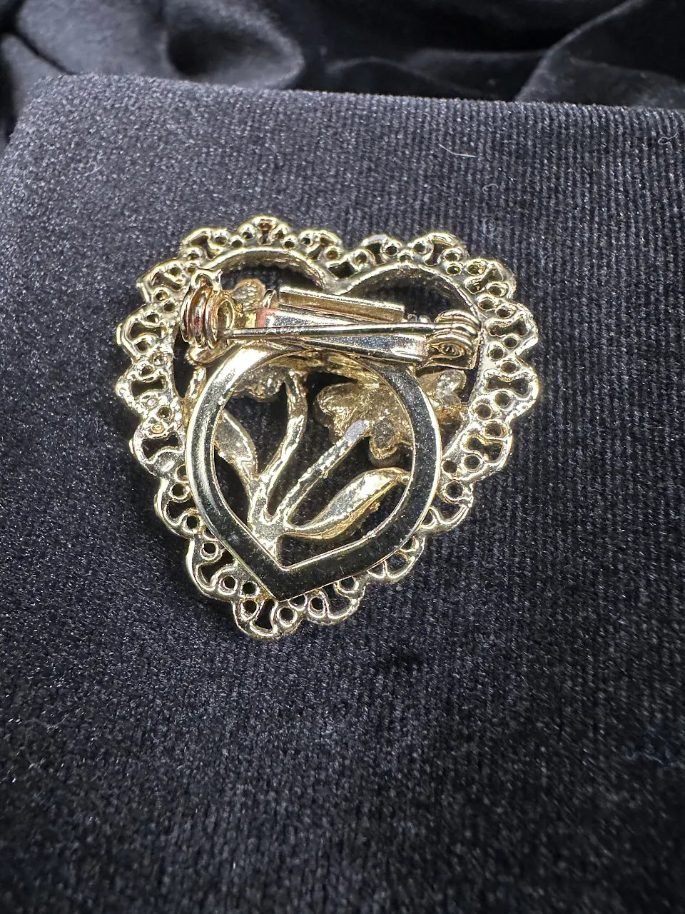 Gold-tone heart brooch with openwork border and raised flower design, view 2