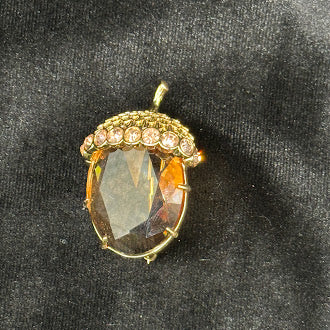 Signed gold-tone acorn brooch with faceted amber-toned body and rhinestone cap, view 3
