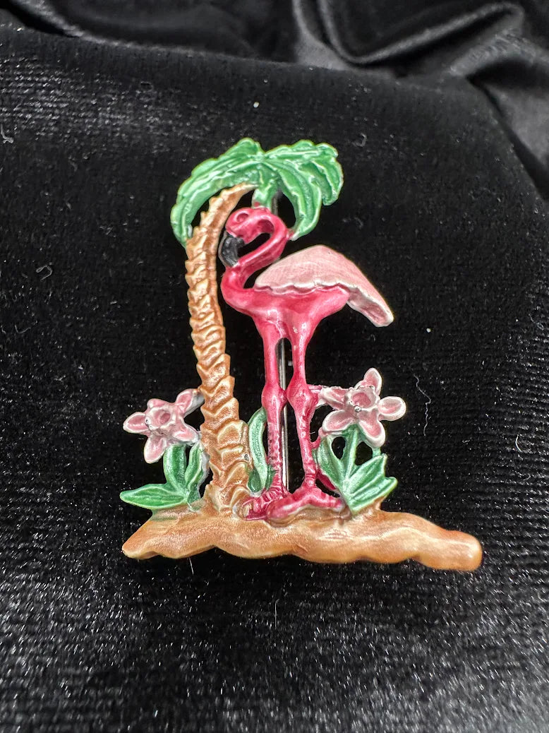 Gold-tone pink enamel flamingo brooch under a green palm tree with floral accents, view 2