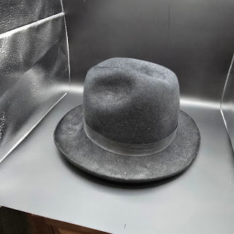 Adolfo II black felt fedora style hat with feather accent