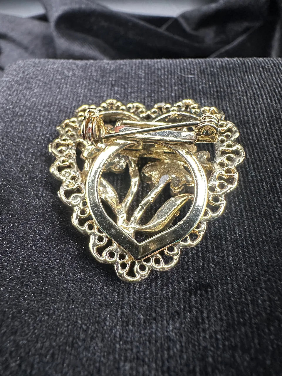Gold-tone heart brooch with openwork border and raised flower design, view 3