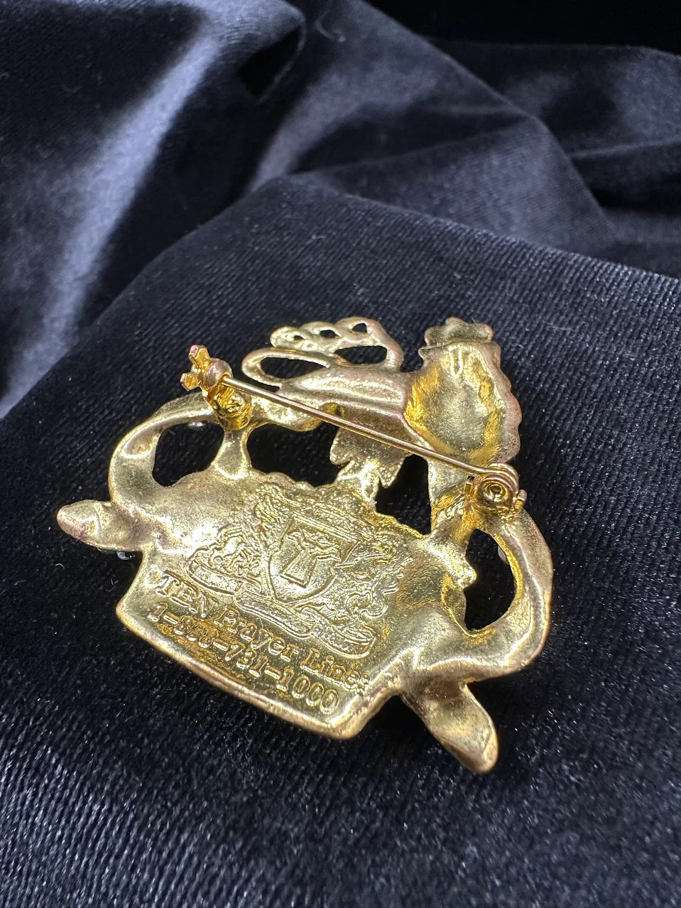 Gold-tone ornate crown brooch topped with a lion, set with clear and purple crystals, view 5
