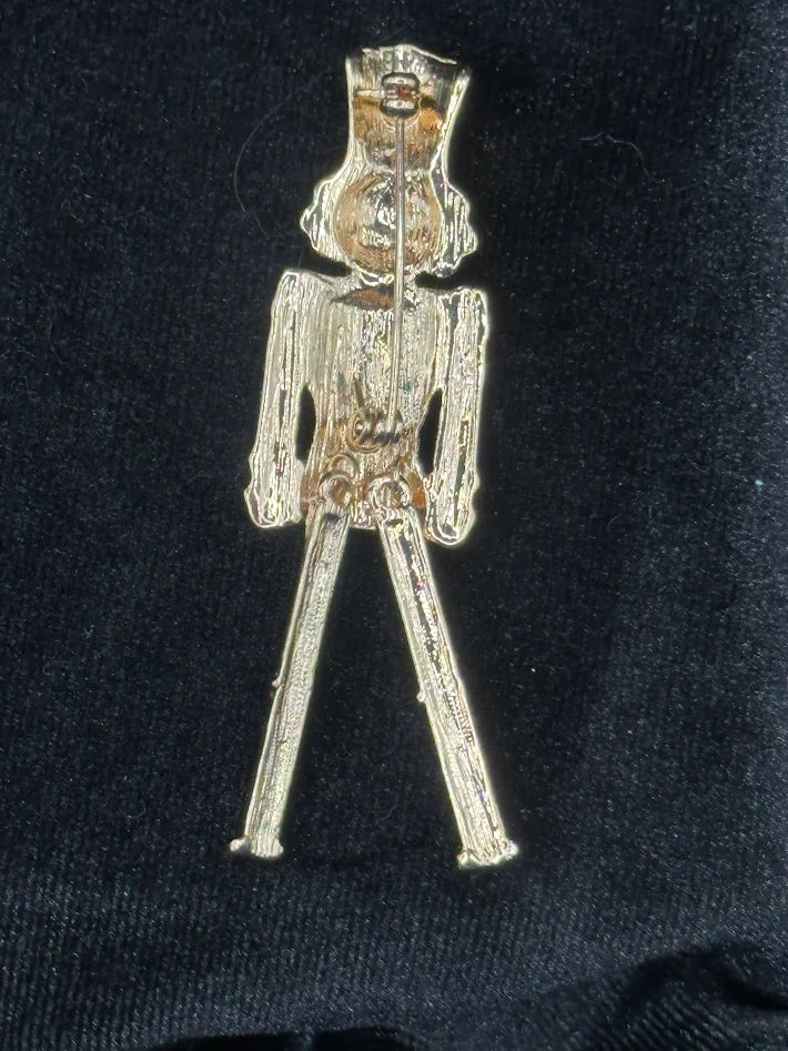 Articulated nutcracker soldier Christmas brooch with red glitter enamel jacket and green trousers, view 3