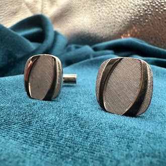 Vintage silver tone oval tie tack set with brushed textured panel design and chain back
