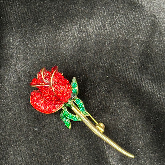 Signed Monet gold-tone long stem rose brooch with red enamel and green rhinestone leaves, view 3