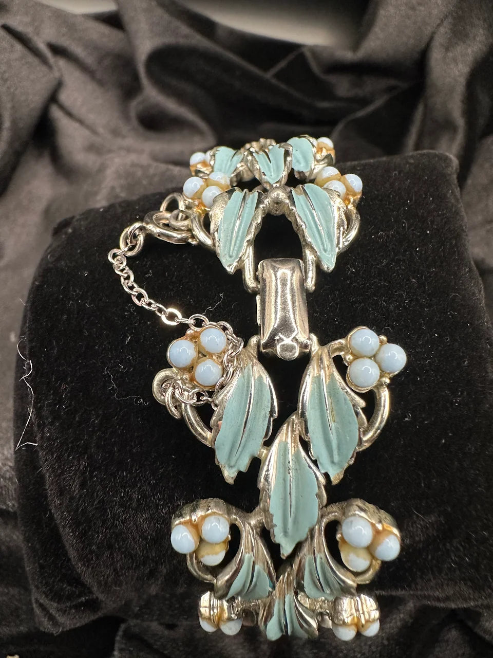 Silver-tone openwork bracelet with blue leaves and pale blue bead flowers, view 4
