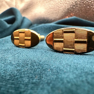 Vintage gold tone oval tie tack set with textured geometric design and chain back