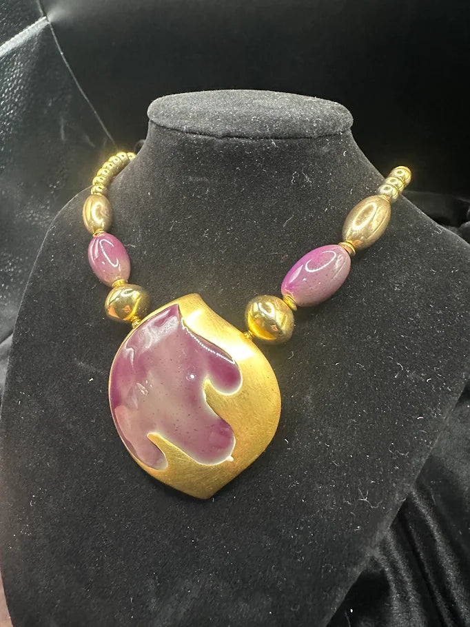 Gold-tone necklace with large purple enamel pendant and purple bead accents, view 3