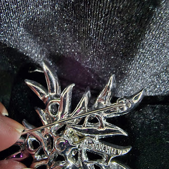 Signed Sarah Coventry silver-tone starburst brooch with clear and aurora borealis rhinestones, view 3