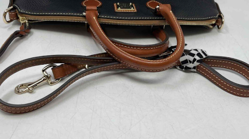 Dooney and Bourke black pebbled leather satchel with cognac brown trim, view 6
