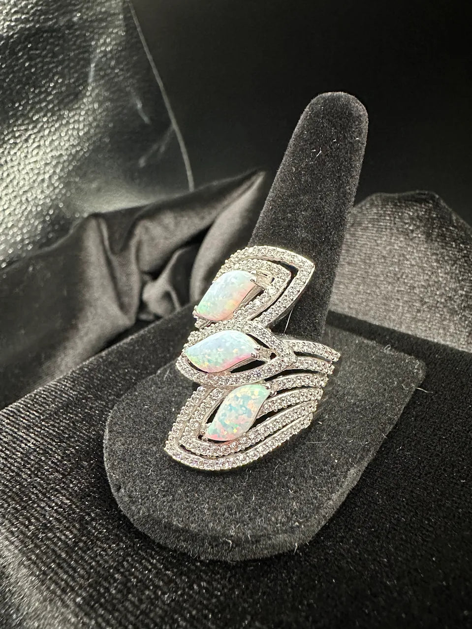 Silver-tone wrap ring with three iridescent opal-look marquise stones and clear crystals, view 3