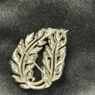 circa 1960s Crown Trifari Gold Tone Blue Enamel Leaf Wreath Brooch Botanical Pin Signed