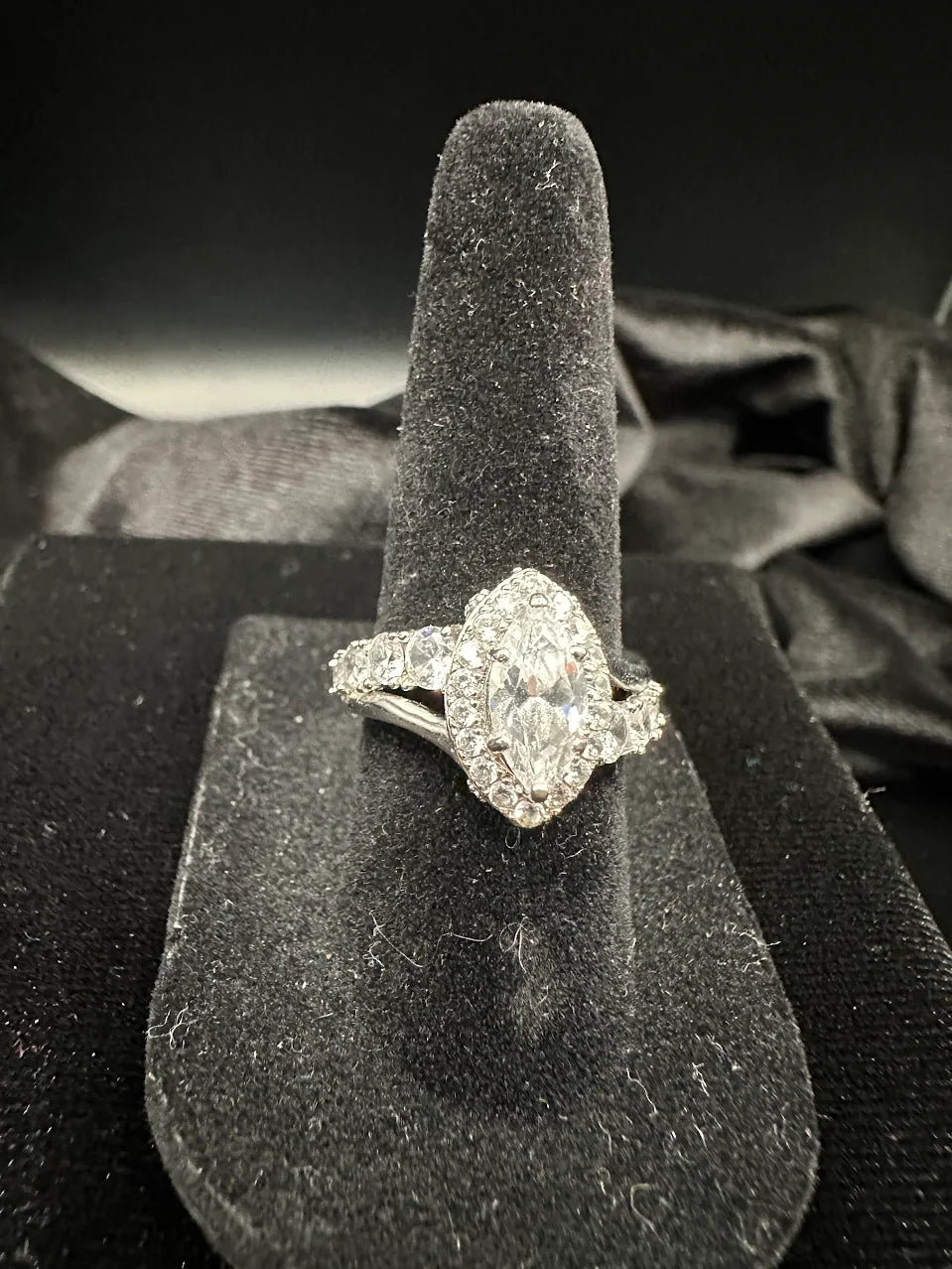 Silver-tone ring with marquise clear crystal center in a crystal halo, view 2