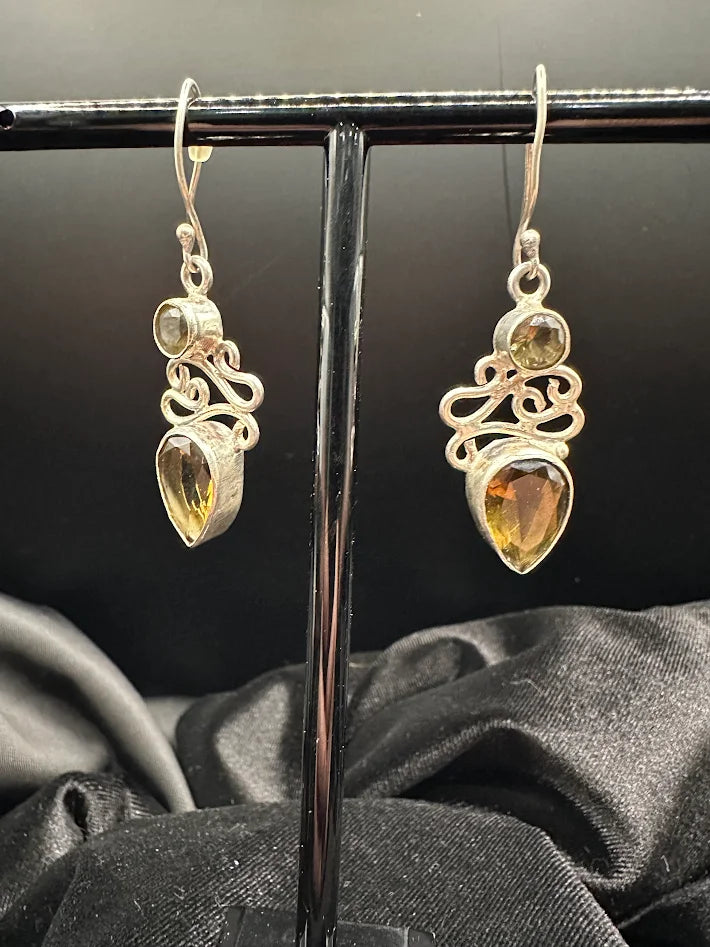 Silver-tone openwork scroll drop earrings with round and teardrop amber-toned stones, view 2