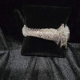 Silver-tone rhinestone clamper bangle with double swirl flower ends and iridescent crystals, view 3