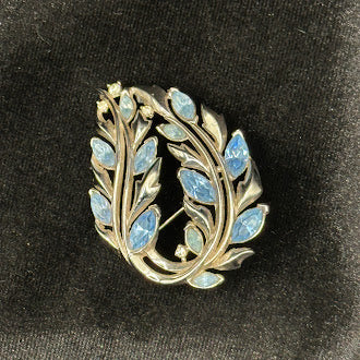 circa 1960s Crown Trifari Gold Tone Blue Enamel Leaf Wreath Brooch Botanical Pin Signed