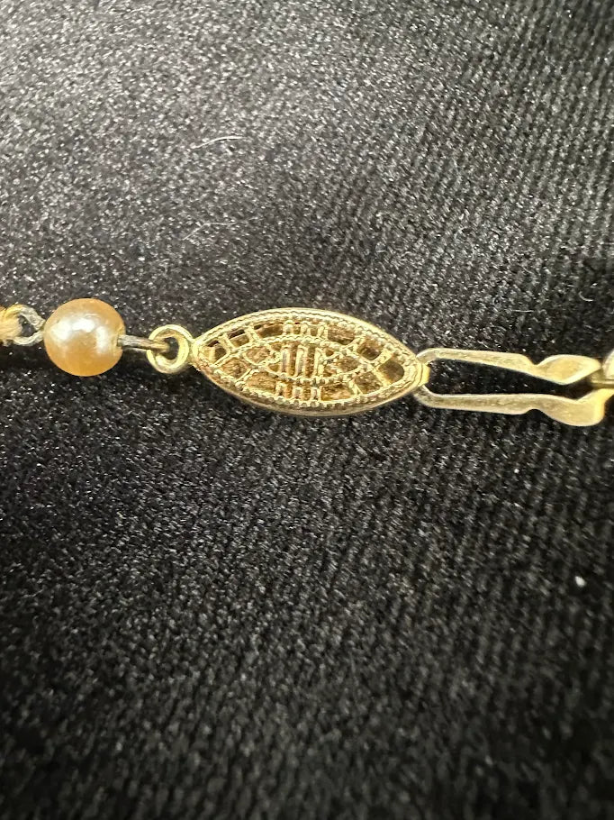 Single strand cream faux pearl necklace with gold-tone filigree clasp, view 3