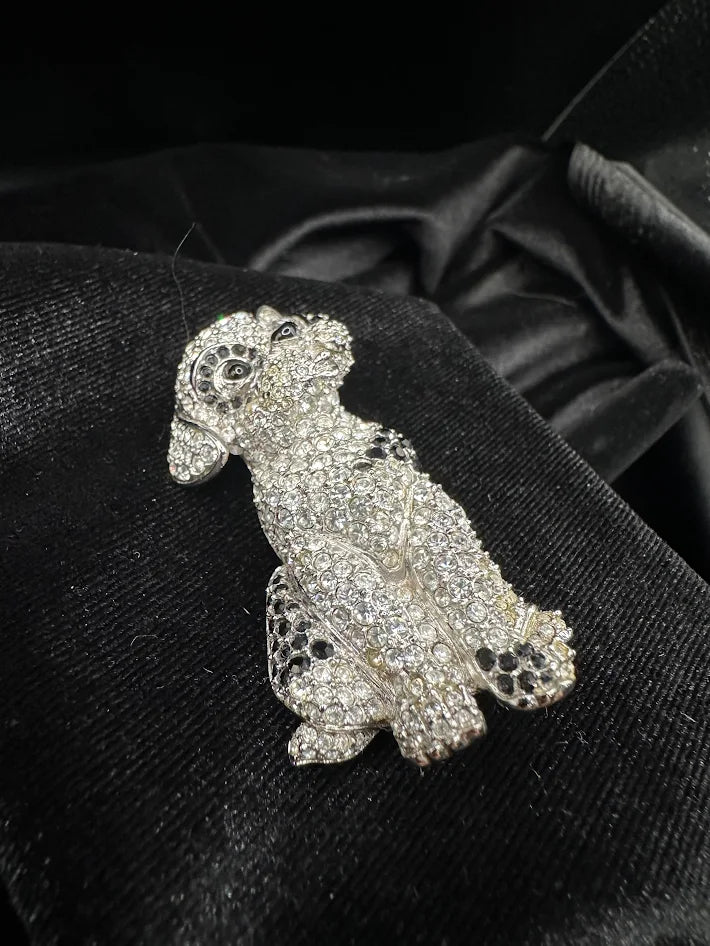 Silver-tone seated dog brooch covered in clear crystals with black crystal ears and spots, view 4