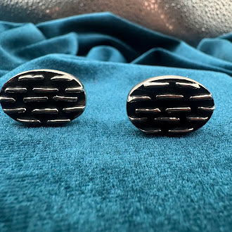 Vintage silver tone oval tie tack set with black enamel geometric pattern and chain back