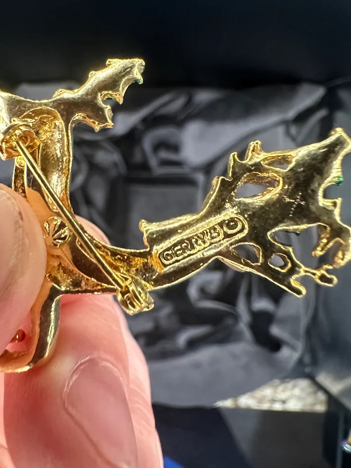 Gold-tone leaping reindeer Christmas brooch with green enamel holly and red rhinestone, view 3