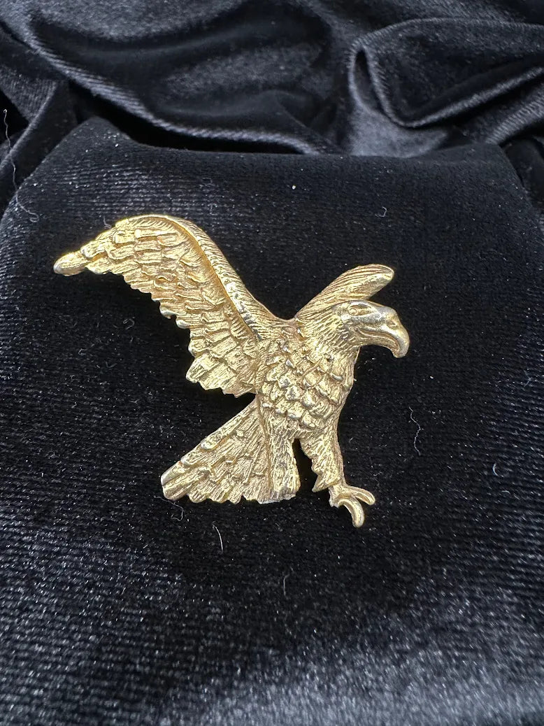 Textured gold-tone eagle brooch with wings extended in flight, view 2