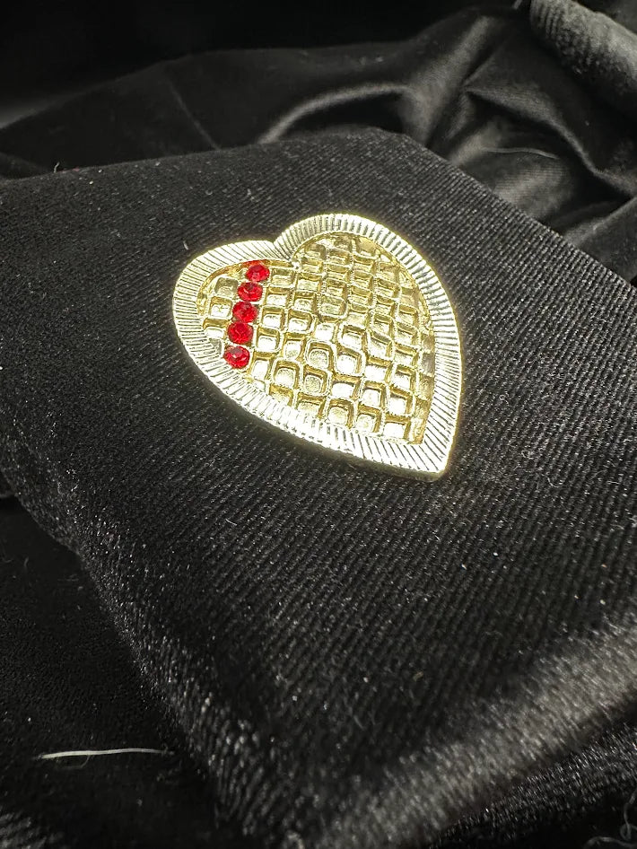 Pale gold-tone heart brooch with open lattice center and red rhinestones, view 4