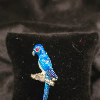 Gold-tone parrot brooch with blue enamel perched on a branch with long tail, view 2