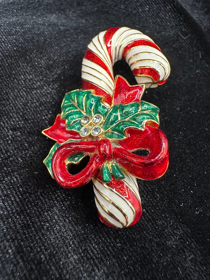 Red and white enamel candy cane Christmas brooch with green holly, red bow and clear stones, view 5
