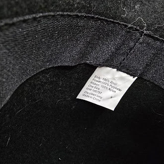 Black felt cloche hat with layered flower accent