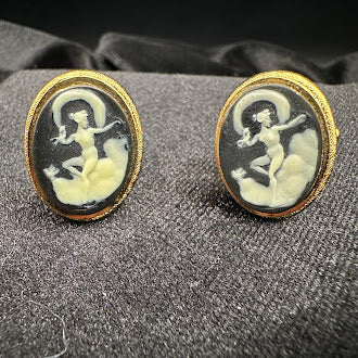 Gold-tone oval cameo-style cufflinks with raised light figure on dark ground, view 2