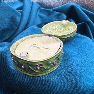 Green enamel ladybug trinket box with floral trim and rhinestone accents, view 7