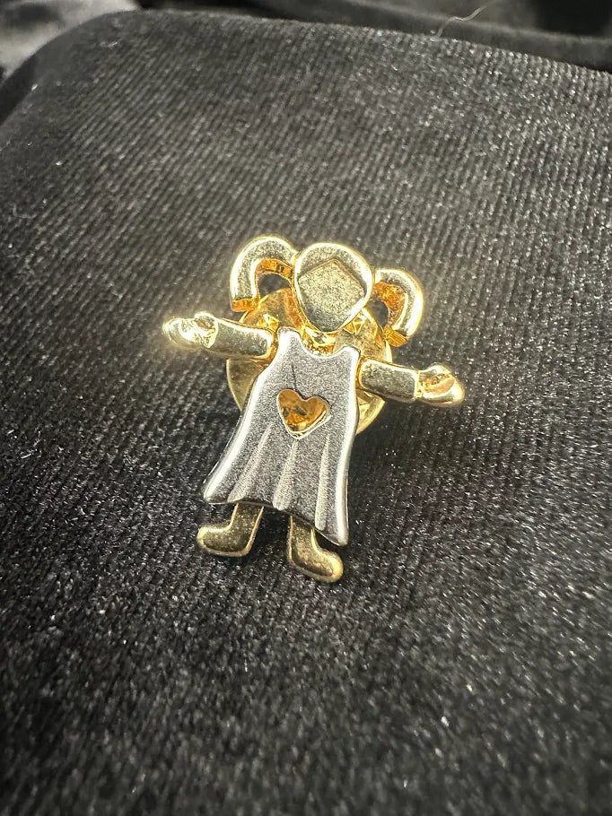 Two-tone figural brooch of a little girl with a heart cutout dress and golden hair, view 2