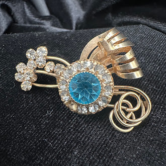 Gold-tone brooch and matching screw-back earrings with blue center stones and clear rhinestone halos, view 6
