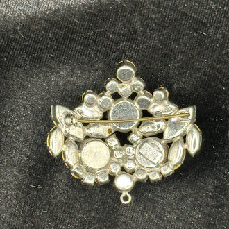Silver-tone brooch pendant marked Austria with light blue and teal rhinestones, view 3
